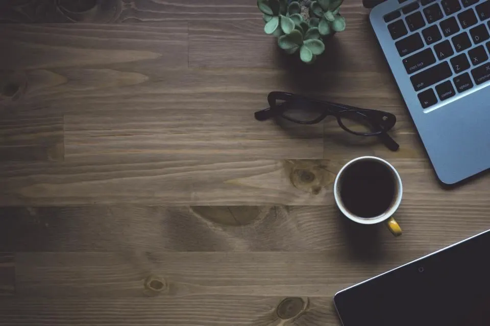 Billing lead reading a Federal Register rule notice next to a CMS payment update summary